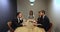 Young leader woman holding negotiations in small meeting room