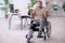 Young leg injured man in wheel-chair