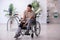 Young leg injured man in wheel-chair