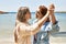 Young lesbian couple of two women in love at the beach