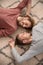 Young LGBT couple lying on floor