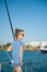 Young little girl sunbathing aboard recreational boat