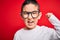 Young little smart boy kid wearing nerd glasses over red isolated background annoyed and frustrated shouting with anger, crazy and