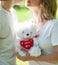 Young love couple holding valentine\'s bear