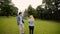 Young lovely couple dancing in a park in summer. Romantic dating or lovestory