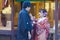 Young Lovely Couple in Traditional Geisha Kimono Feeding Each Other with Dango Moti Balls in