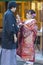 Young Lovely Couple in Traditional Geisha Kimono Posing With Dango Moti Balls in Kyoto, Japan