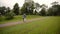 Young lovely couple walking in a park in summer. Romantic dating or lovestory