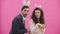 A young lovers couple appears on the pink background, reproducing horses of hares. With the ears of a pink rabbit on the