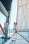 Young lovers spending happy time on a yacht at sea