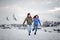 Young lovers spending time and having fun in mountains