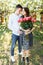 Young loving couple in love, girl holding flowers, happy and enjoy the beautiful nature, advertising, and utsava text