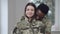 Young loving interracial couple posing at home before husband leaving for military service. Portrait of slim beautiful