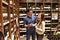 Young lucky couple shopping for wine in the supermarket