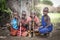 Young maasai boys resting under a tree