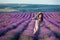 Young magic adorable woman in lavender field on summer day dancing and enjoy life time with woman girl power