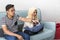 Young Malay Couple at the Sofa watching tv together