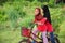 A young malay female children ride a bicycle at their hometown. View a background of Malay rural village.