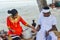 Young maldivian couple dressed in national clothes cooking food