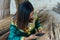 Young maldivian girl in national clothes using mobile phone