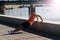 Young male athlete exercising by the Danube river at quay in Novi Sad, Serbia. Healthy lifestyle, outdoor running, sports concept.