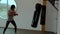 Young male athlete exercising kickboxing video. Healthy lifestyle concept.