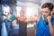 Young male athletes punching with dumbbells