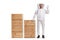 Young male bee keeper in a uniform standing next to wooden crates and gesturing good