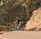 Young male on a bicycle in wild terrain