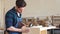 Young male carpenter working in the wood workshop