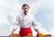 Young male chef standing near cooking table