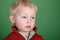 Young male child portrait on green screen