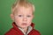 Young male child portrait on green screen