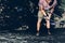 Young Male Climber Hanging On A Rock On A Rope And Looks Somewhere On The Wall. Extreme Lifestyle Outdoor Activity Concept