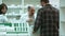 Young male customer buy medical products in a drugstore