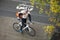 Young Male Cyclist With Backpack On Sidewalk