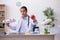 Young male doctor dietician holding apple and pizza box