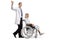 Young male doctor waving and pushing a female patient in a wheelchair