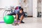 The young male employee exercising in the office