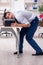 Young male employee making copies at copying machine