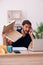 Young male employee ordering pizza at workplace