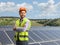 Young male engineer standing on a sustainable solar farm