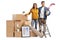 Young male and female posing with a pile of packed cardboard boxes