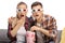 Young male and female watching a 3d movie and eating popcorn