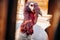 young male gobbler with a big red wart-shaped growth over a wooden fence