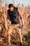 Young male handsome man, farmer working with tablet and harvesting on corn crops