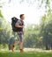 Young male hiker with a backpack walking in a park