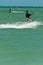 Young male kiteboarding tropical waters of Gulf of Mexico