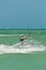 Young male kiteboarding tropical waters of Gulf of Mexico