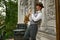 Young male musician practicing saxophone in balcony at home